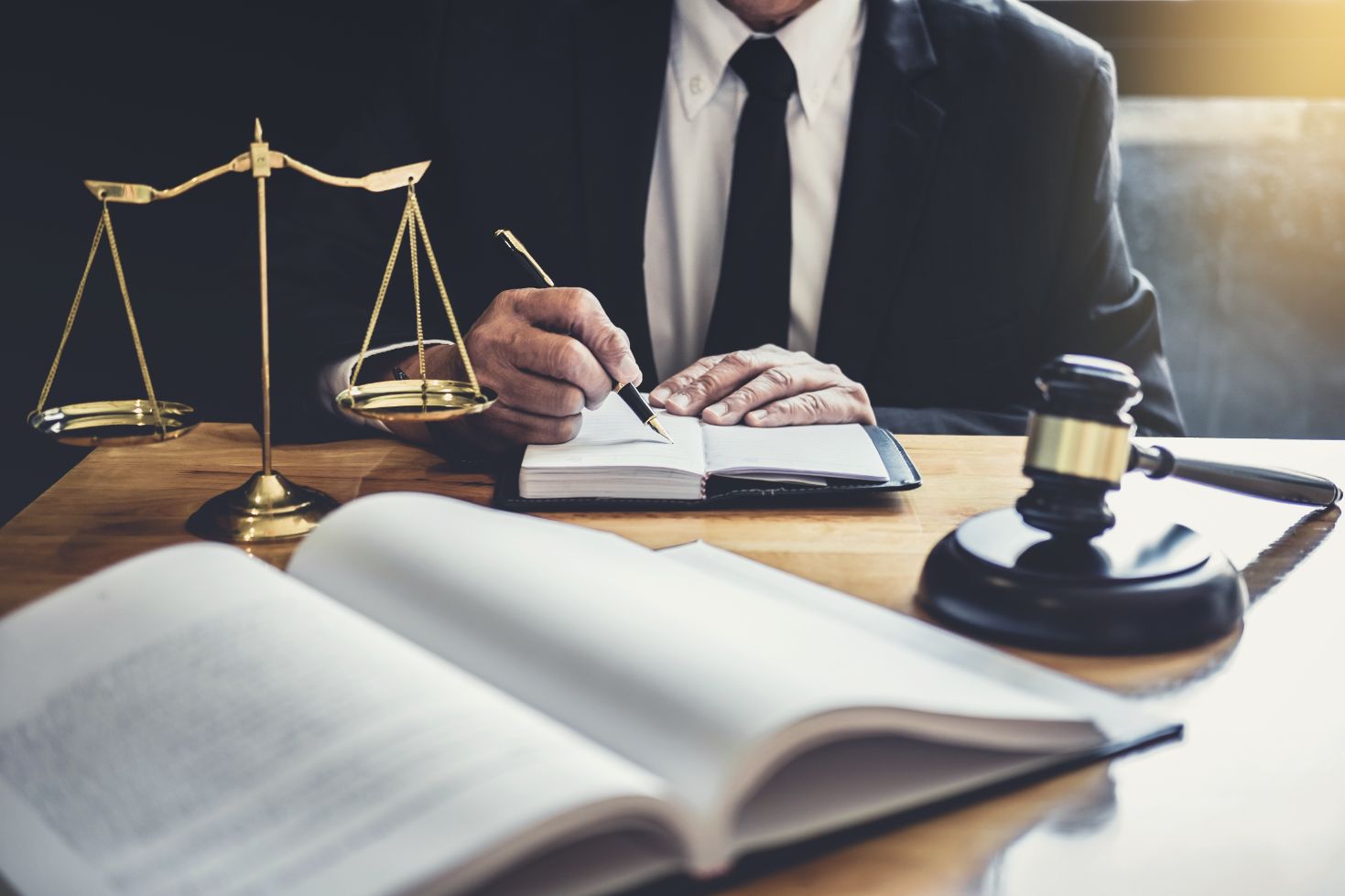 male-lawyer-or-judge-working-with-contract-papers (1)